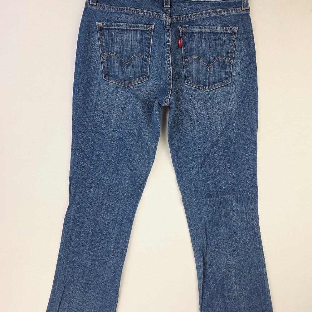 Levi's Mid Rise Boot Cut 553 Women Size 6 Medium 32 Inch Inseam Blue Logo Jeans